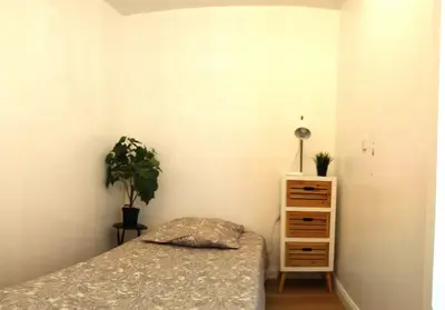 Un ou plusieurs lits dans un hébergement de l'établissement Résidence du Parc de Lyon Est 102m2 pkg free