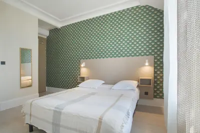 Un ou plusieurs lits dans un hébergement de l'établissement GAB HOUSE - Lyon Bron - Eurexpo City Living Stay