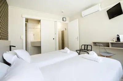 Un ou plusieurs lits dans un hébergement de l'établissement GAB HOUSE - Lyon Bron - Eurexpo City Living Stay
