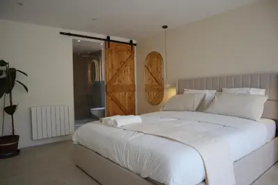 Un ou plusieurs lits dans un hébergement de l'établissement Suite l'Aparté