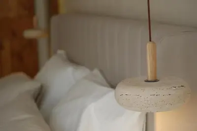 Un ou plusieurs lits dans un hébergement de l'établissement Suite l'Aparté