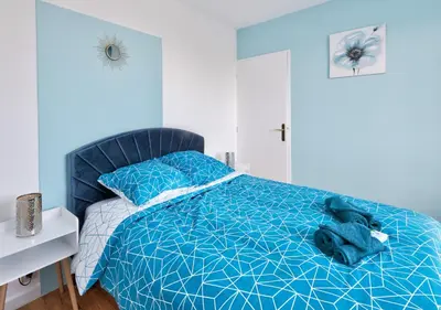 Un ou plusieurs lits dans un hébergement de l'établissement Appartement cosy - Tonkin, parc Tête d'or