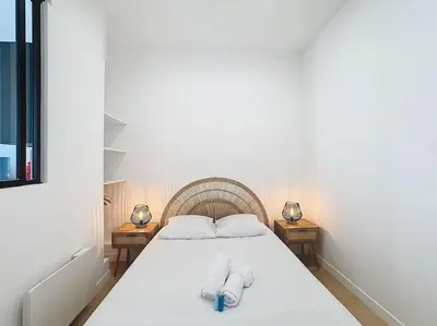 Un ou plusieurs lits dans un hébergement de l'établissement Cosy appartement, Lyon Centre Capucins 1