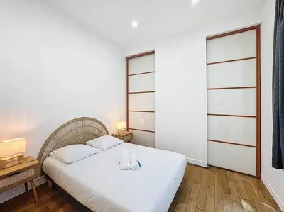Un ou plusieurs lits dans un hébergement de l'établissement Cosy appartement, Lyon Centre Capucins 2