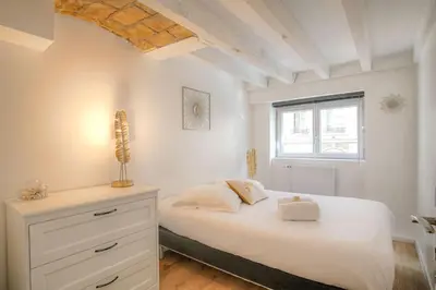 Un ou plusieurs lits dans un hébergement de l'établissement Appartement spacieux, proche gare, Lyon 3e
