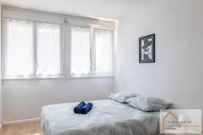 Un ou plusieurs lits dans un hébergement de l'établissement La Belle Escale - appartement lumineux à proximité d'Eurexpo