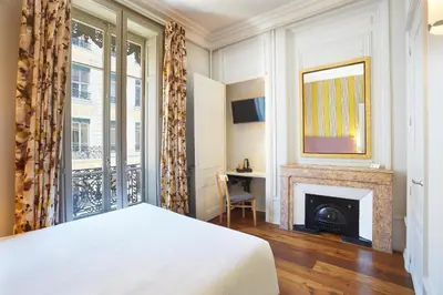 Un ou plusieurs lits dans un hébergement de l'établissement Hôtel Vaubecour - Centre Lyon Ainay - Perrache