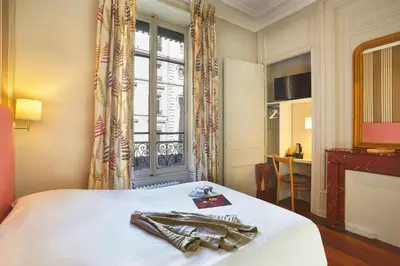 Un ou plusieurs lits dans un hébergement de l'établissement Hôtel Vaubecour - Centre Lyon Ainay - Perrache