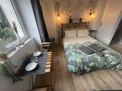 Un ou plusieurs lits dans un hébergement de l'établissement VERDI studio COSY au calme parking gratuit