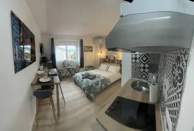 Un ou plusieurs lits dans un hébergement de l'établissement VERDI studio COSY au calme parking gratuit