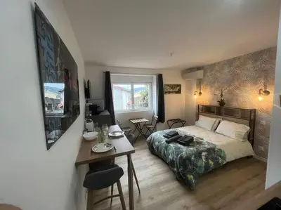 Un ou plusieurs lits dans un hébergement de l'établissement VERDI studio COSY au calme parking gratuit