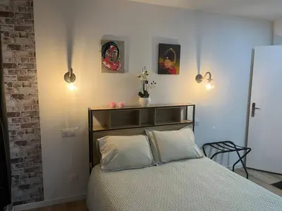 Un ou plusieurs lits dans un hébergement de l'établissement BACH studio BALNEO au calme parking gratuit