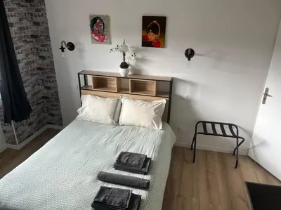 Un ou plusieurs lits dans un hébergement de l'établissement BACH studio BALNEO au calme parking gratuit