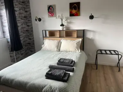 Un ou plusieurs lits dans un hébergement de l'établissement BACH studio BALNEO au calme parking gratuit