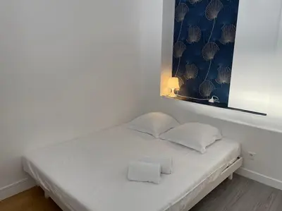 Un ou plusieurs lits dans un hébergement de l'établissement Studio moderne et lumineux, proche Tete d Or, Lyon