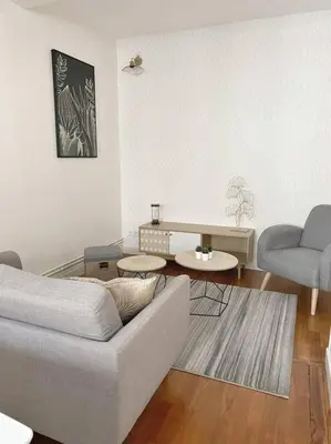 Coin salon dans l'établissement Appartement T4 charmant bien situé, Charpennes