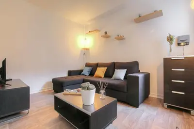 Coin salon dans l'établissement Appartement spacieux et moderne, Lyon 6ème