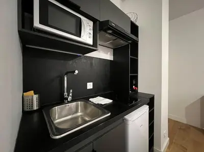 Cuisine ou kitchenette dans l'établissement Studio chaleureux, proche gare, Lyon 3
