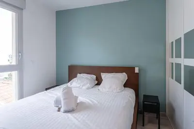 Un ou plusieurs lits dans un hébergement de l'établissement Appartement bien équipé avec parking, Lyon 8