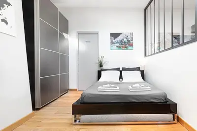 Un ou plusieurs lits dans un hébergement de l'établissement Loft élégant climatisé, Centre-ville Lyon Terreaux