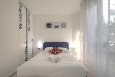 Un ou plusieurs lits dans un hébergement de l'établissement Superbe appartement avec jardin proche Lyon 3ème