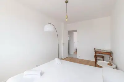 Un ou plusieurs lits dans un hébergement de l'établissement Grand Appartement Cosy - Parking & Balcon