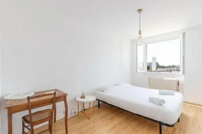 Un ou plusieurs lits dans un hébergement de l'établissement Grand Appartement Cosy - Parking & Balcon