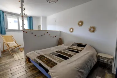 Un ou plusieurs lits dans un hébergement de l'établissement Le Studio Cosy
