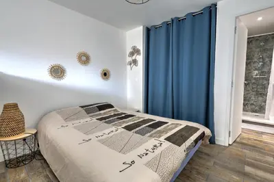Un ou plusieurs lits dans un hébergement de l'établissement Le Studio Cosy