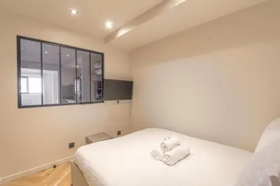 Un ou plusieurs lits dans un hébergement de l'établissement Appartement lumineux pour 4, Villeurbanne Cusset