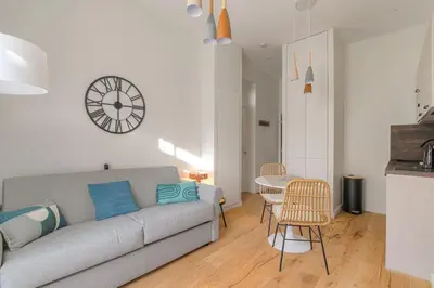 Coin salon dans l'établissement T2 neuf, climatisé proche Lyon