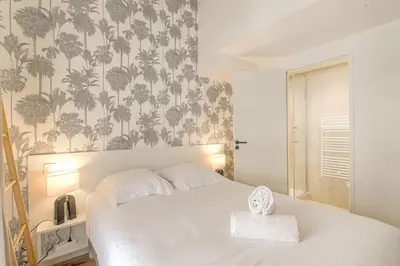 Un ou plusieurs lits dans un hébergement de l'établissement Appartement T3 neuf, climatisé proche Lyon 3