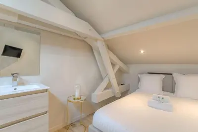 Un ou plusieurs lits dans un hébergement de l'établissement Studio moderne et équipé en duplex, Villeurbanne