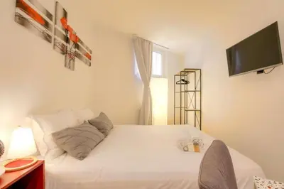 Un ou plusieurs lits dans un hébergement de l'établissement Studio chaleureux - Proche Presqu'île de Lyon