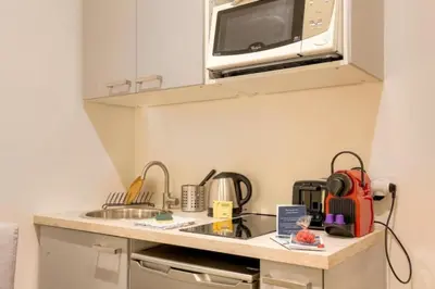 Cuisine ou kitchenette dans l'établissement Studio chaleureux - Proche Presqu'île de Lyon