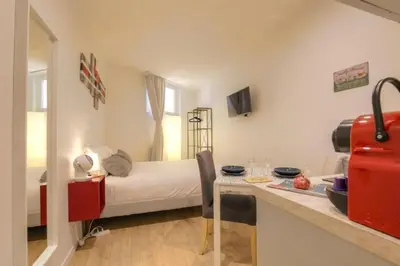 Un ou plusieurs lits dans un hébergement de l'établissement Studio chaleureux - Proche Presqu'île de Lyon