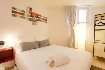 Un ou plusieurs lits dans un hébergement de l'établissement Studio chaleureux - Proche Presqu'île de Lyon