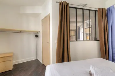 Un ou plusieurs lits dans un hébergement de l'établissement Appartement cosy et lumineux, Berges du Rhône