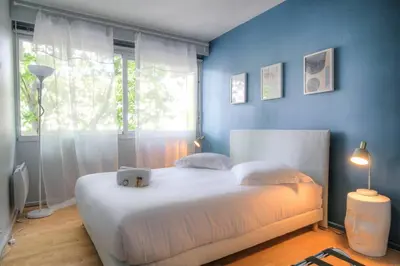 Un ou plusieurs lits dans un hébergement de l'établissement Appartement moderne proche Lyon 6ème