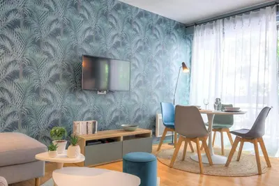 Télévision ou salle de divertissement dans l'établissement Appartement moderne proche Lyon 6ème