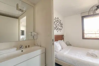 Un ou plusieurs lits dans un hébergement de l'établissement Bel appartement avec vue imprenable, Lyon-Vaise