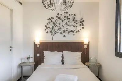 Un ou plusieurs lits dans un hébergement de l'établissement Bel appartement avec vue imprenable, Lyon-Vaise