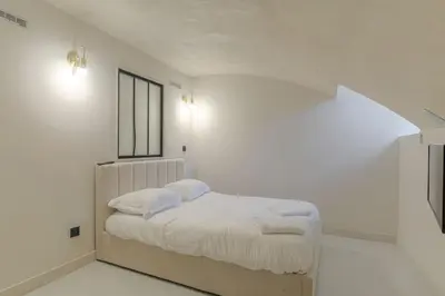 Un ou plusieurs lits dans un hébergement de l'établissement Superbe duplex avec parking, Tour-de-Salvagny