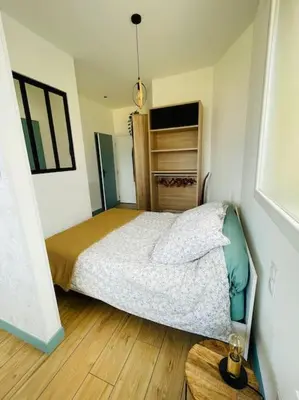 Un ou plusieurs lits dans un hébergement de l'établissement Studio Ô terrasses de Virieu