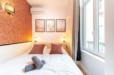 Un ou plusieurs lits dans un hébergement de l'établissement Le Marietton appartement cosy à deux pas du métro Valmy
