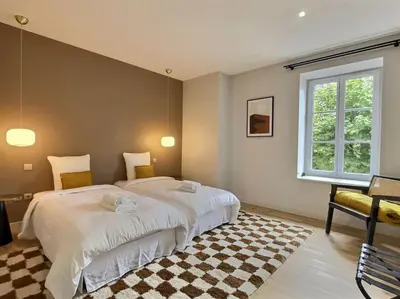 Un ou plusieurs lits dans un hébergement de l'établissement La maison de Vincent de Miss K