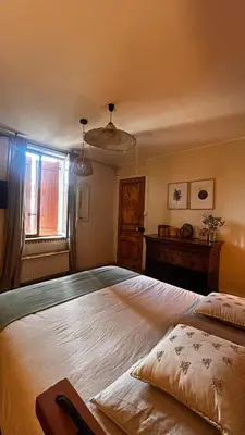 Un ou plusieurs lits dans un hébergement de l'établissement UNE FERME EN VILLE Chambres d'hôtes et Table d'hôtes