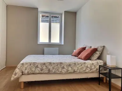 Un ou plusieurs lits dans un hébergement de l'établissement Charmante maison de village