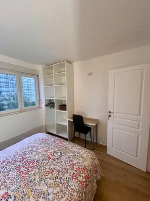 Un ou plusieurs lits dans un hébergement de l'établissement Chambre privée dans un appartement partagé