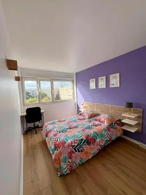 Un ou plusieurs lits dans un hébergement de l'établissement Chambre privée dans un appartement partagé